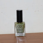 Starlet glitter nail paint shimmering on nails in Sunshine Gold shade