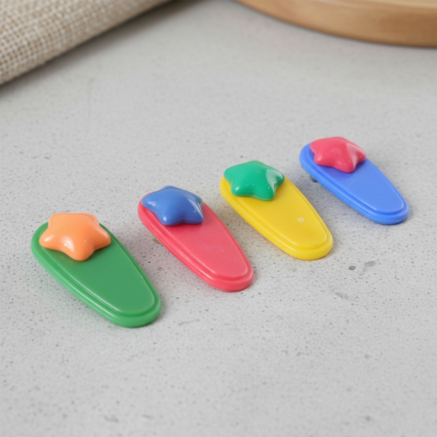 Close-up view of colorful star hair clip design with smooth finish