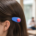 Backside clasp of colorful star hair clips showing secure grip