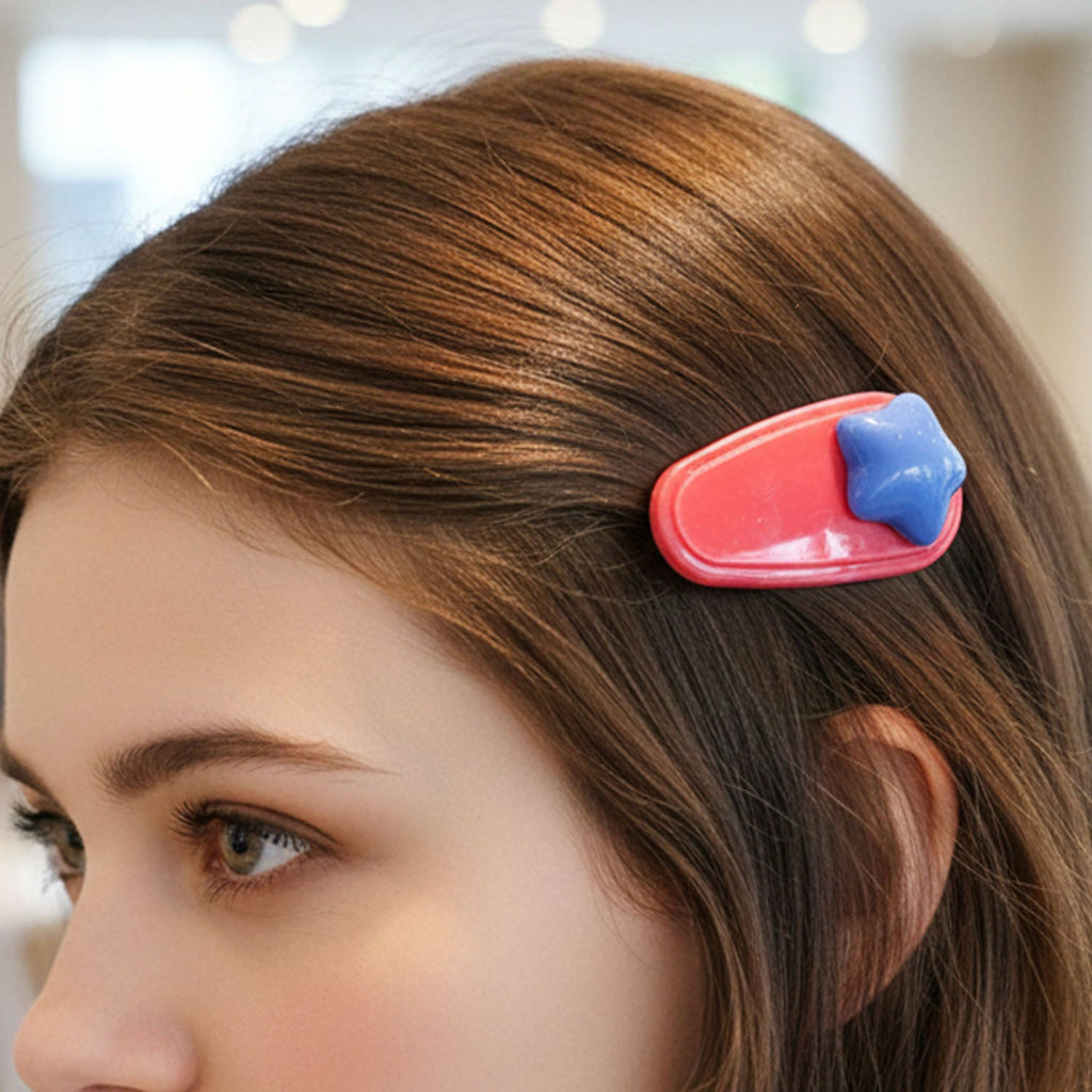 Set of four star-shaped colorful decorative hair clips
