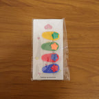 Lifestyle image showcasing colorful star hair clip set in use