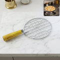 Papad Jali Roaster made of stainless steel with a wooden handle on a clean background.