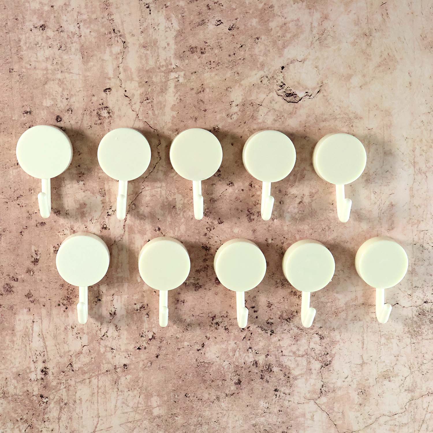 Self adhesive round wall hooks holding small hanging items