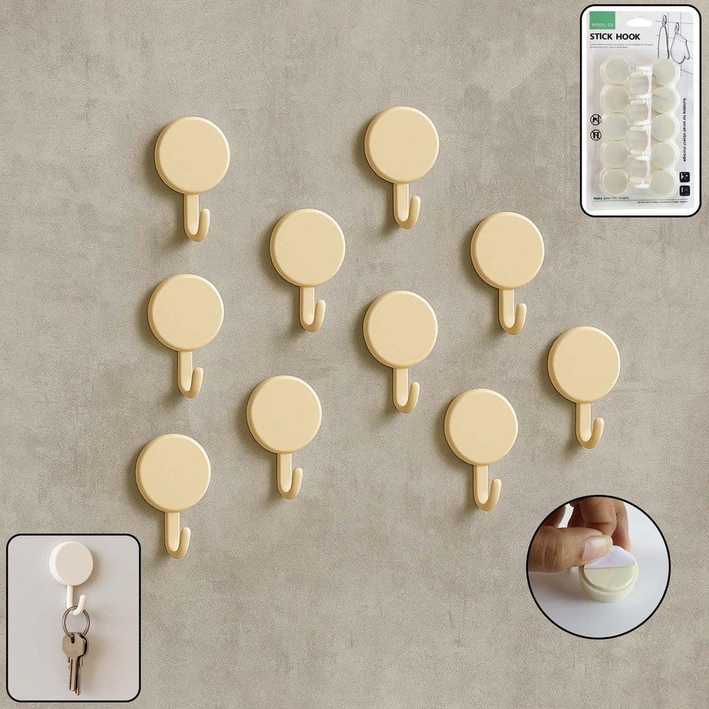 Set of 10 self adhesive round wall hooks arranged neatly for home organization
