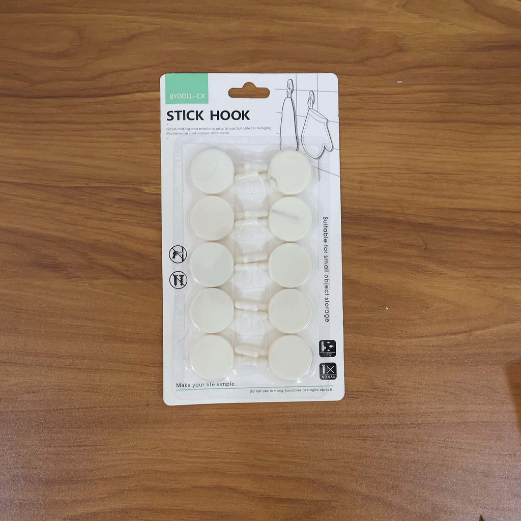 Practical use of self adhesive round wall hooks on a home wall