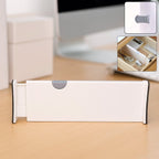 Expandable drawer dividers organizing kitchen utensils neatly in drawer