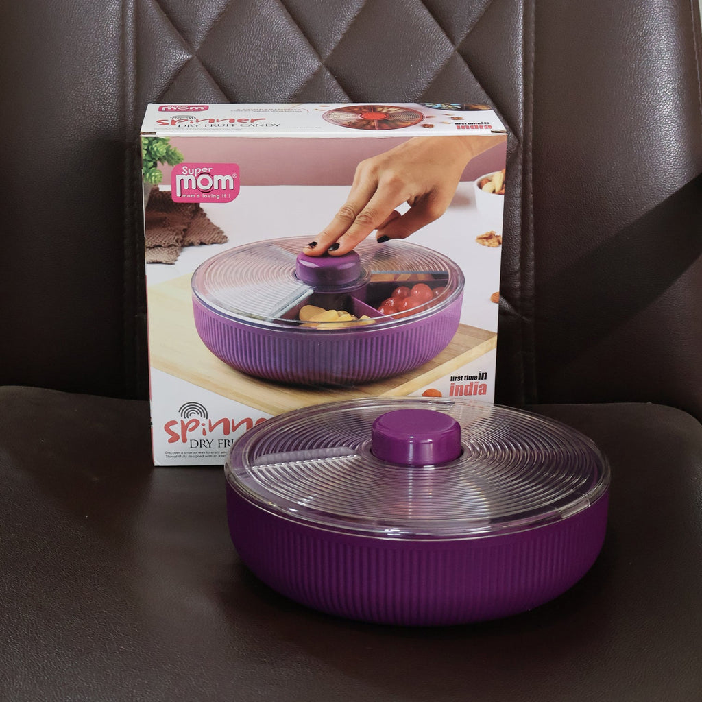 Purple rotating dry fruit container product in clear table setting
