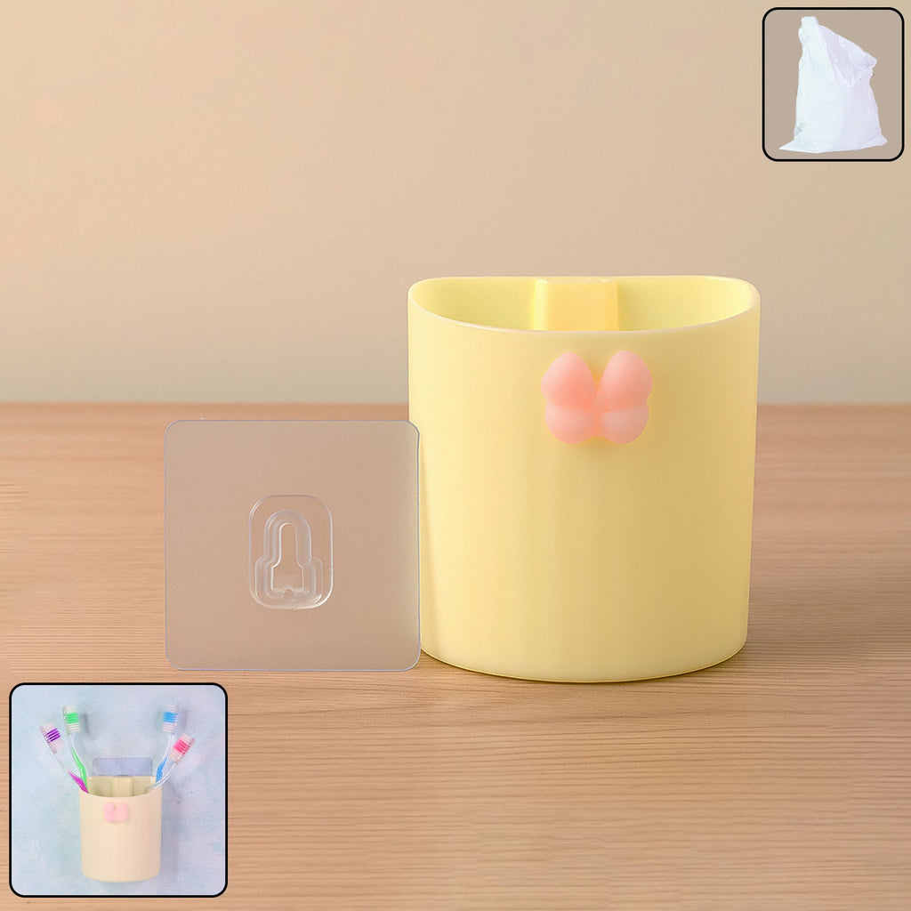 Wall-mounted toothbrush holder with butterfly design on a bathroom wall
