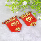 Golden and red Shubh Labh wall hangings adding prosperity symbol to home
