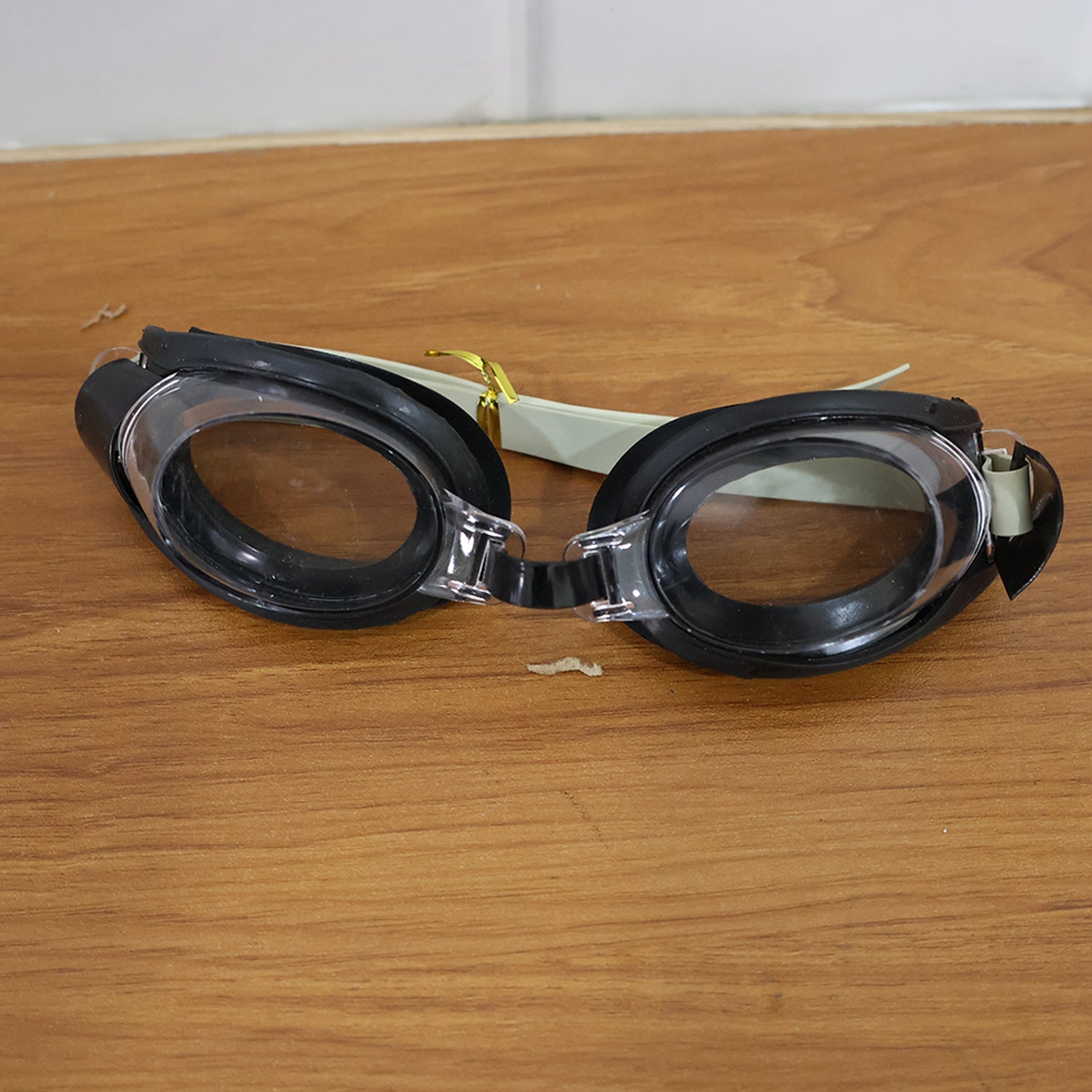 Clear swimming goggles featuring UV protection lenses for eye safety