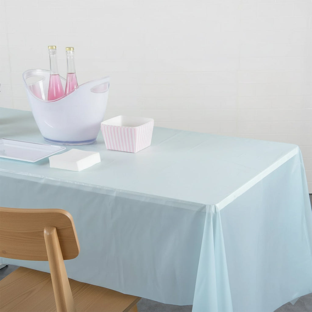 Clear rectangular disposable plastic table cover laid out flat