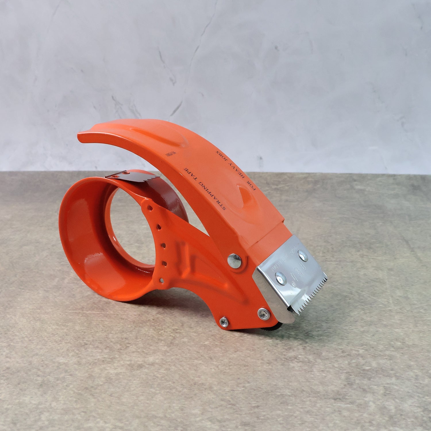 Side view of the heavy-duty packing tape dispenser with its roller.