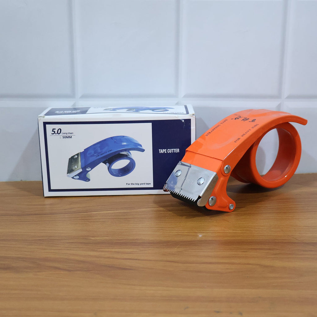 Person using a 50mm packing tape dispenser to seal a cardboard box.