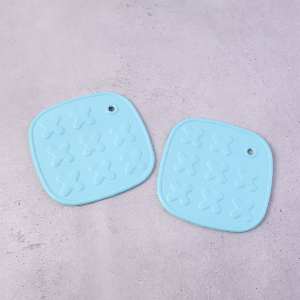 Cup coaster with secure textured non-slip surface for holding hot drinks