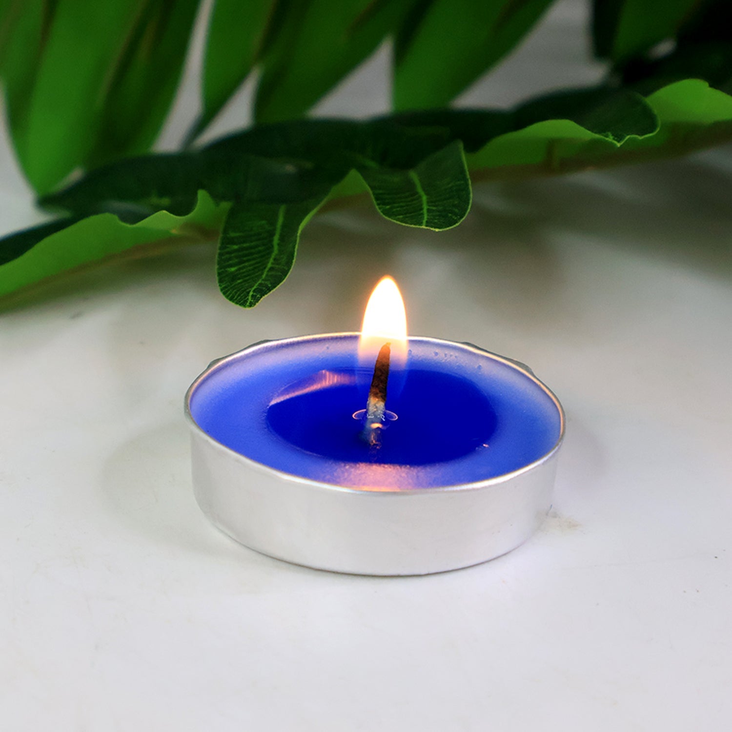Individual scented tea light candles glowing softly for home aromatherapy