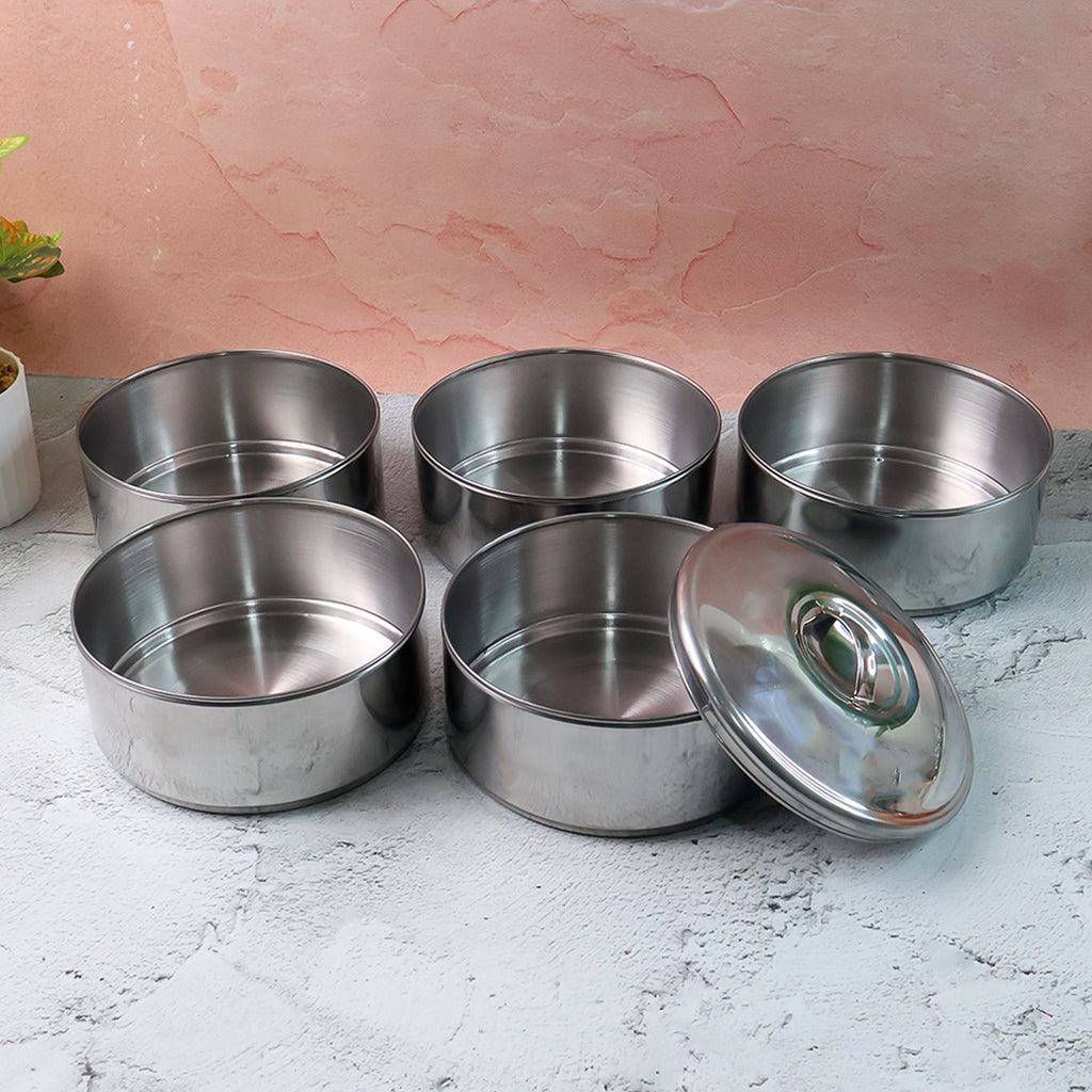 Closed stainless steel lunch box showing its sleek, round design.