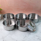 Closed stainless steel lunch box showing its sleek, round design.