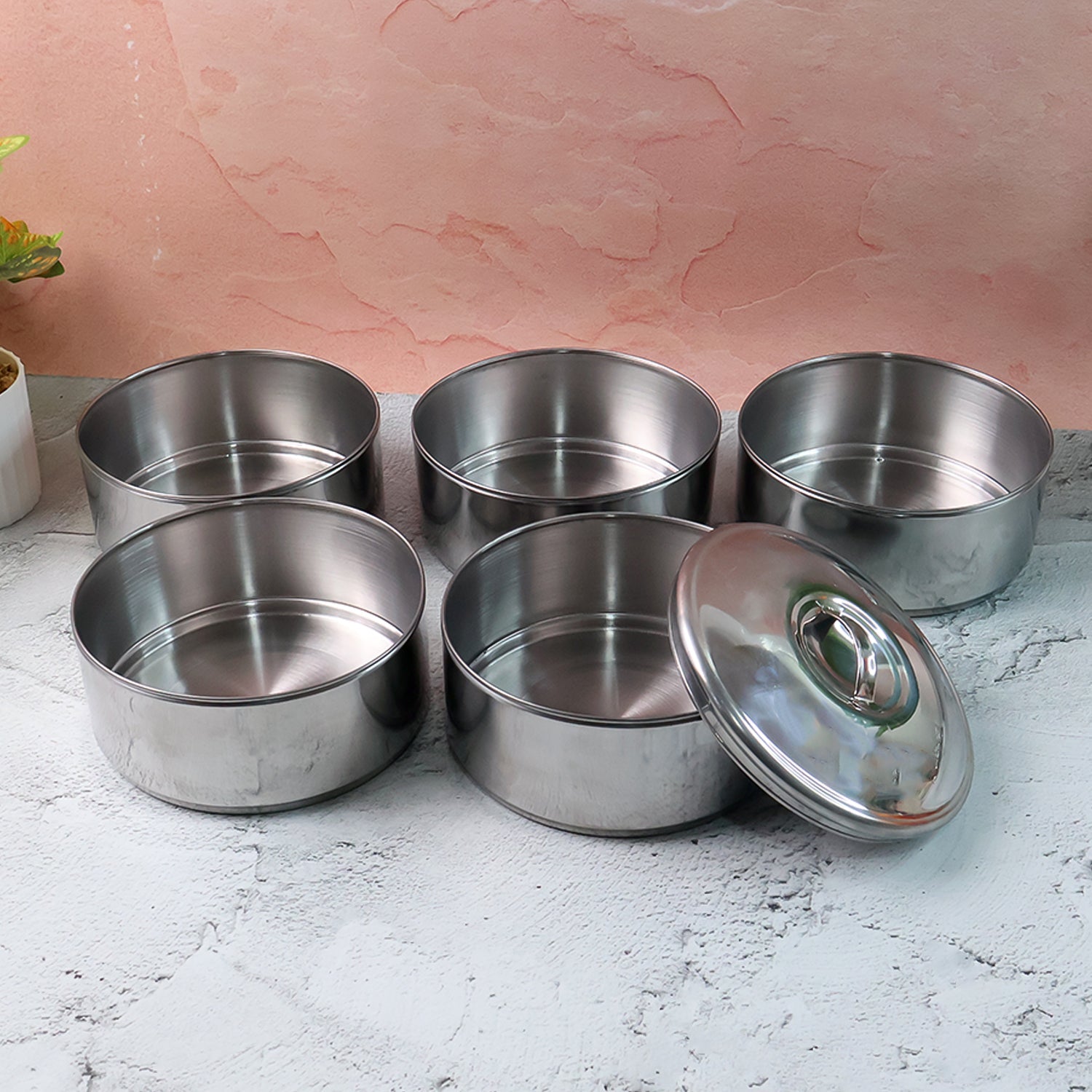 Closed stainless steel lunch box showing its sleek, round design.