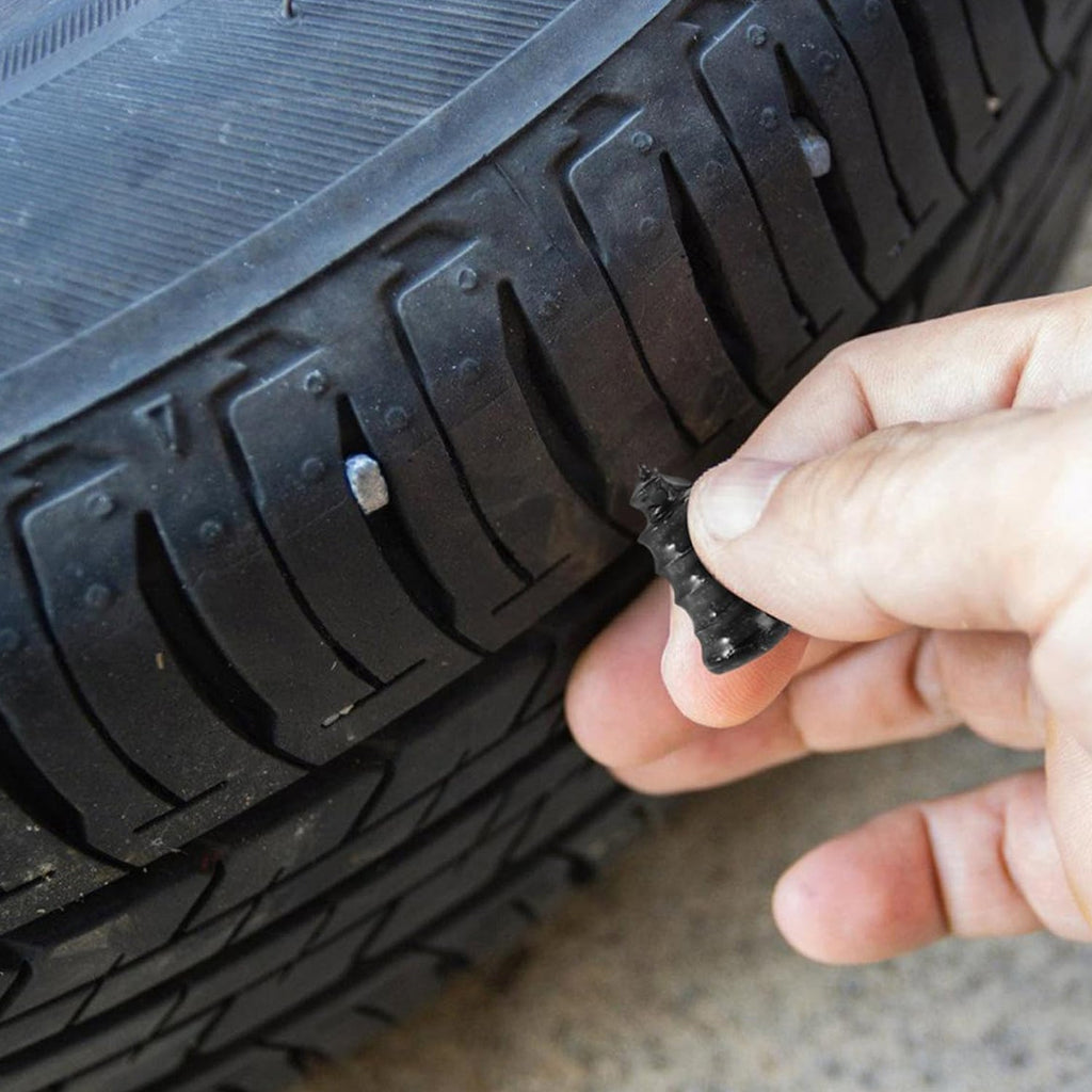 Close-up of pink tire repair nail plug