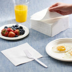 Stacked disposable tissue napkins ready for use