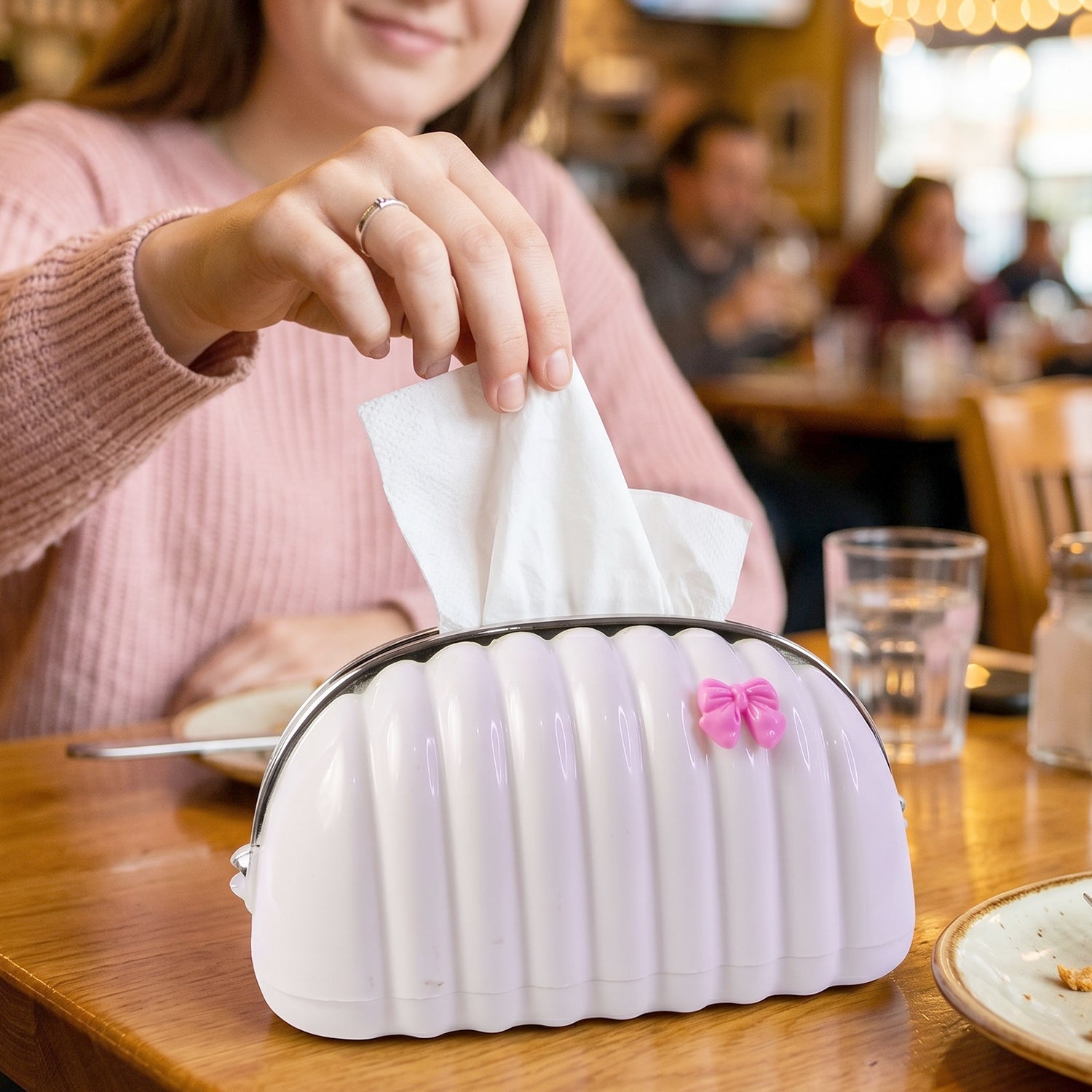 Creative seashell tissue holder with pink bow accent
