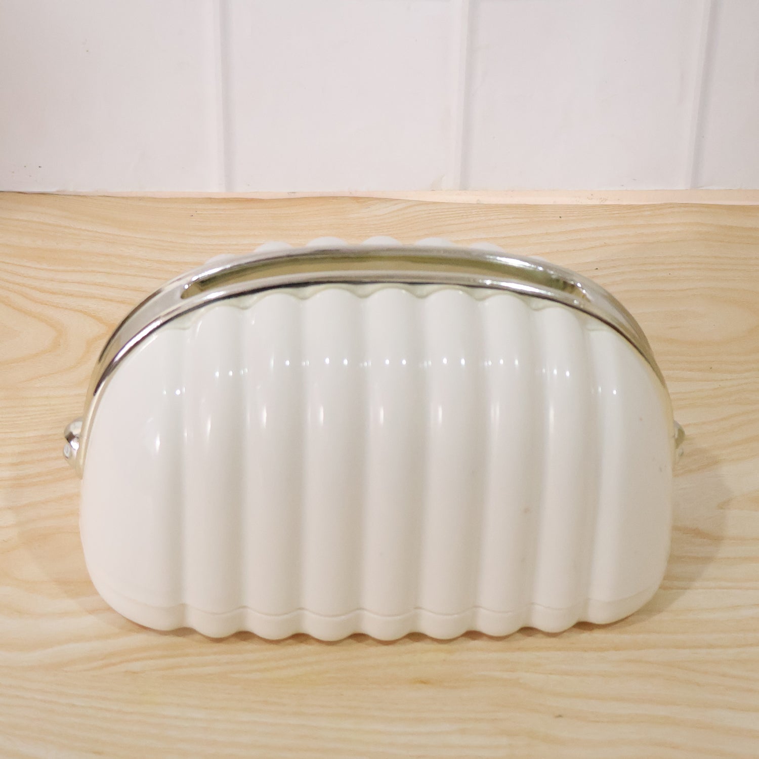 White shell style tissue dispenser front view