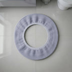 Stretchable toilet seat cover shown separately for demonstration