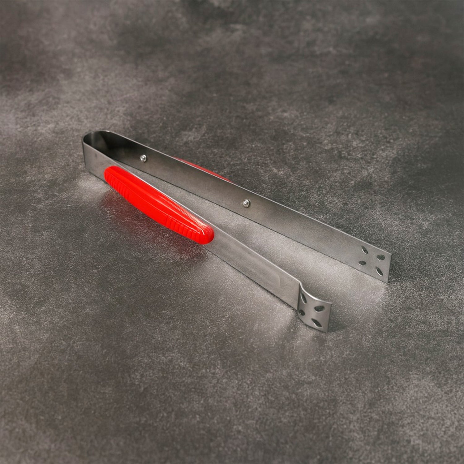 Close-up view of premium stainless steel kitchen tongs by Supermom