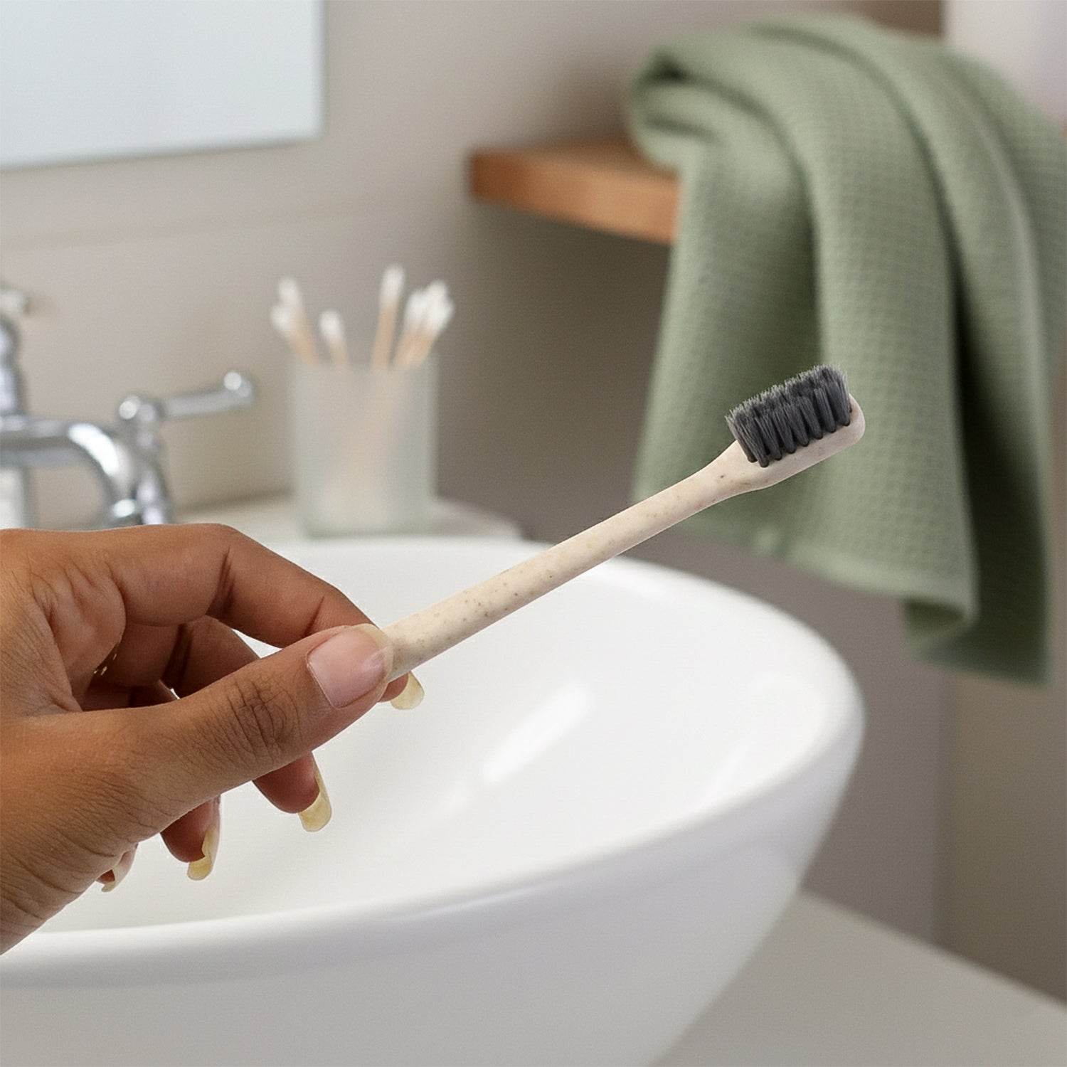The MintGuard Soft-bristle Toothbrush resting on a clean bathroom counter, ready for use.