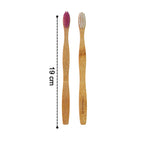 Single bamboo toothbrush on plain white background showcasing eco design