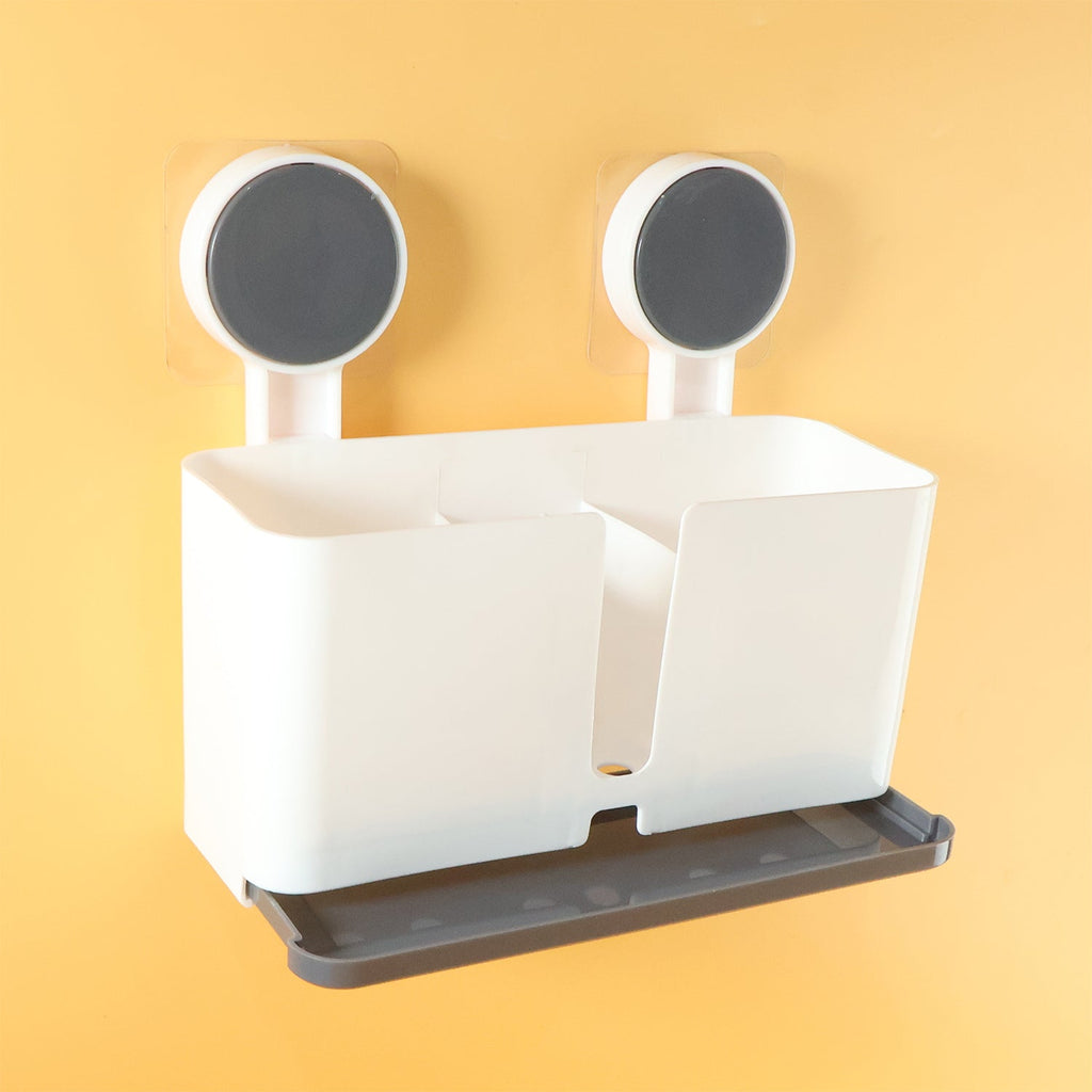 Side angle view of wall mounted toothbrush holder with three compartments
