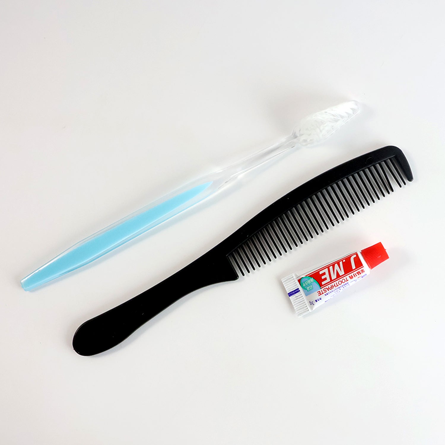 Mini travel hygiene kit featuring toothbrush and comb for quick grooming