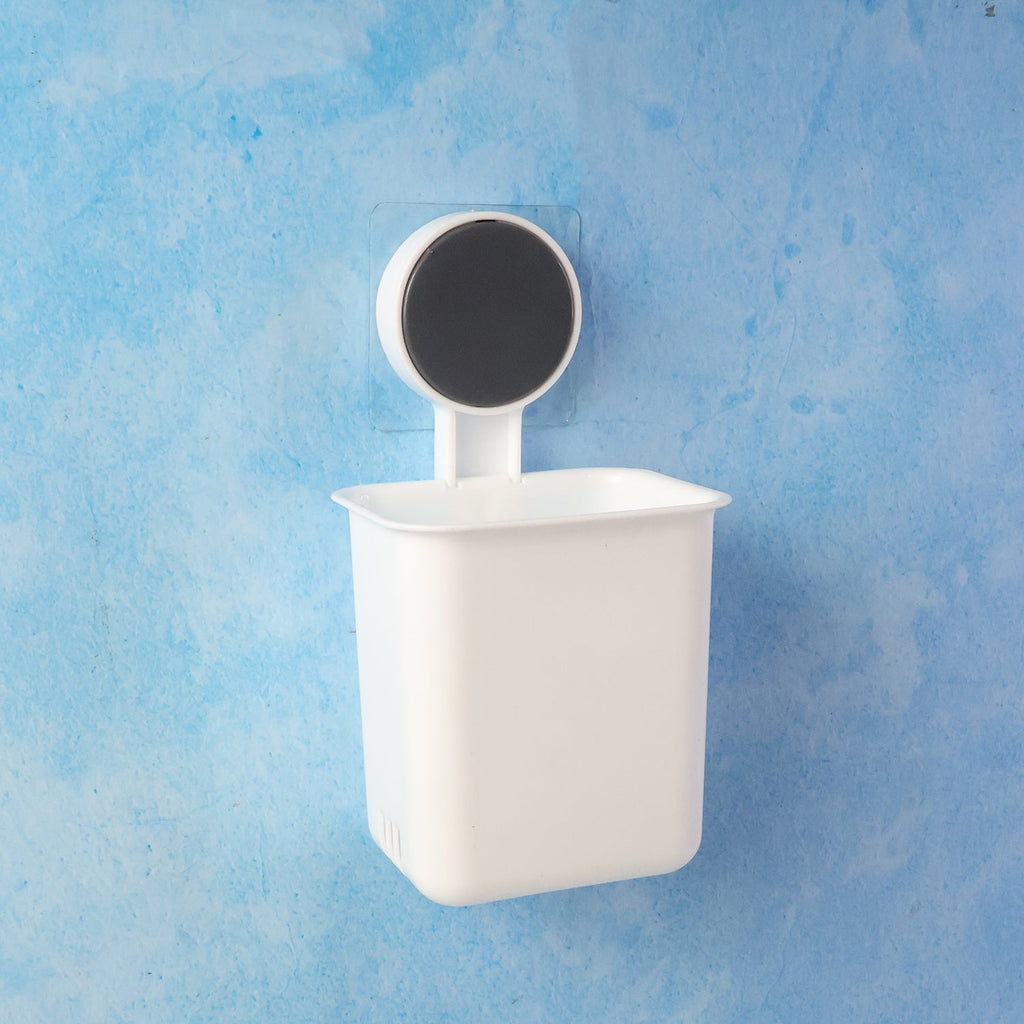 Compact bathroom organizer storing toothbrush and small essentials neatly.