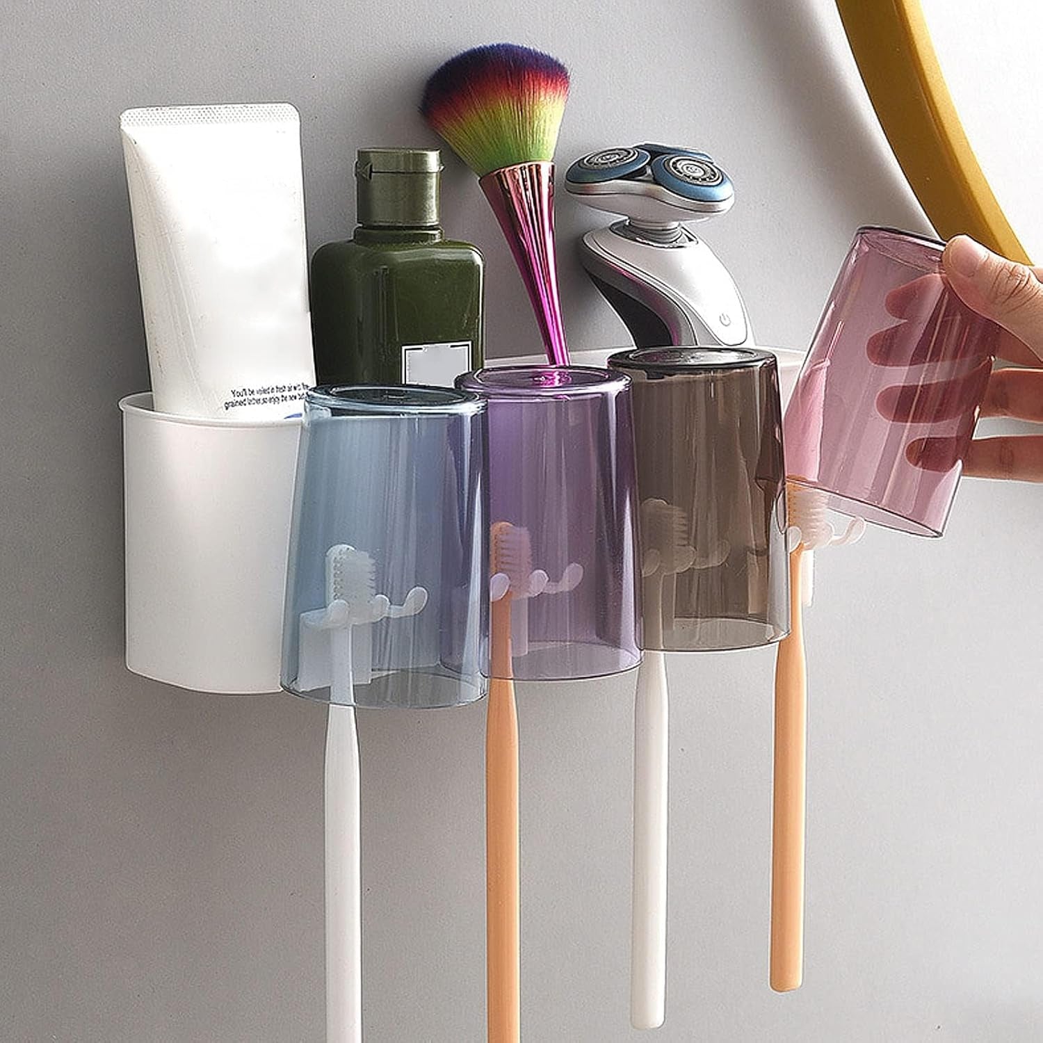 Bathroom toothbrush storage rack mounted on wall with organized sections