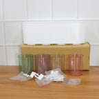 Plastic wall toothbrush rack with four inverted cups and grooming accessory slots