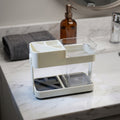 Multipurpose toothbrush holder set on bathroom countertop