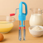 Manual hand beater showing ergonomic handle and gear mechanism