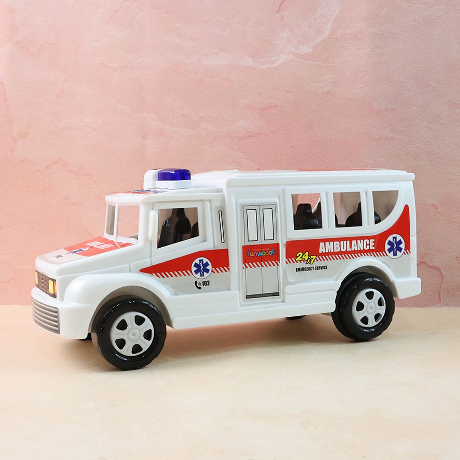 Front angle shot of friction powered ambulance toy with detailed decals