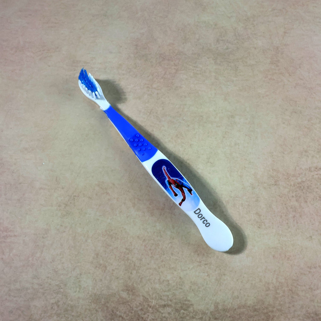 Children’s toothbrush with soft bristles and colorful cartoon design
