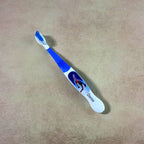 Children’s toothbrush with soft bristles and colorful cartoon design