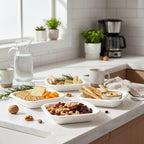 Square disposable serving tray holding a portioned meal for convenience.