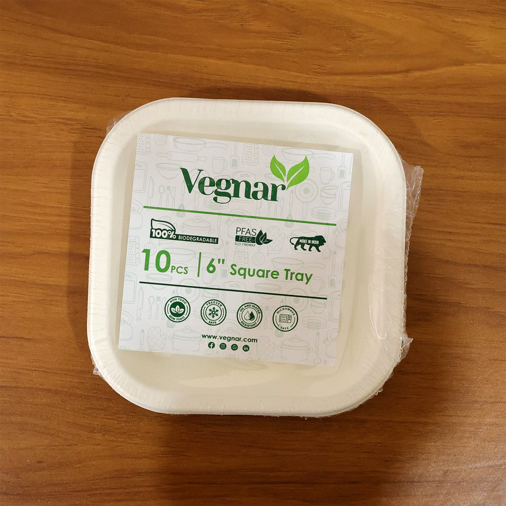 A stack of disposable square food trays ready for quick event use.