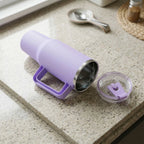 Drink tumbler showing handle and lid