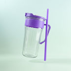 Side view of kids plastic tumbler featuring straw and handle