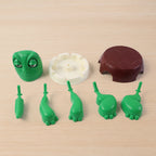 Plastic turtle coaster protecting office desk from spills