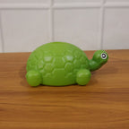 Tortoise money bank in kids room setting