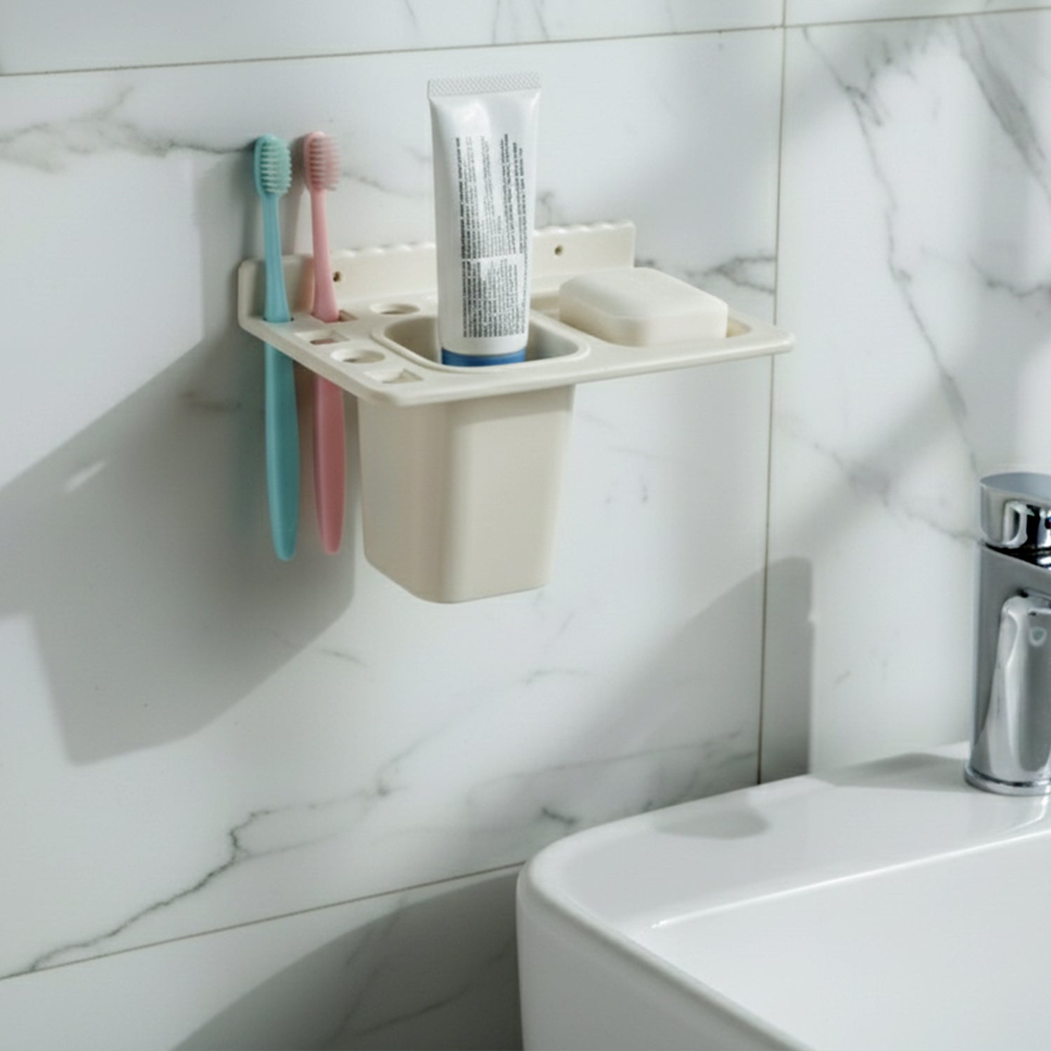 Soap tray with drainage holes in the wall mounted toothbrush holder keeping soap dry.