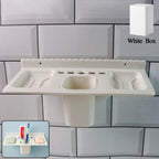 White 4-in-1 wall-mounted bathroom organizer with soap dishes and toothbrush holder.