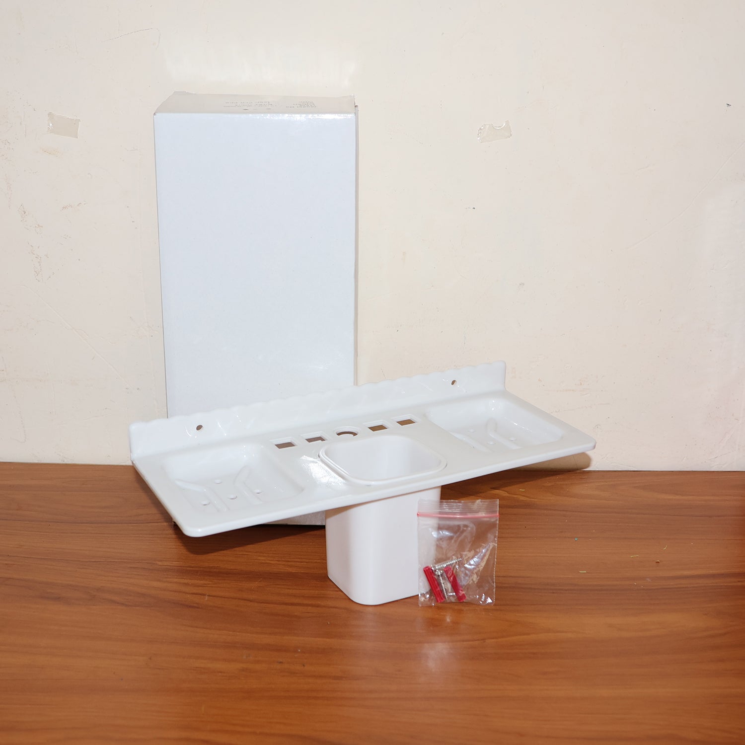 Real-life installation of the wall-mounted organizer in a compact bathroom.