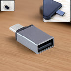Type-C OTG Adapter plugged into a smartphone, enabling external device connection.